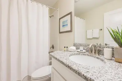a bathroom with a sink and a toilet at Storey Lake Resort 61 - Hosted by Top Villas in Kissimmee