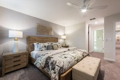 a bedroom with a bed and a ceiling fan at Storey Lake Resort 61 - Hosted by Top Villas in Kissimmee