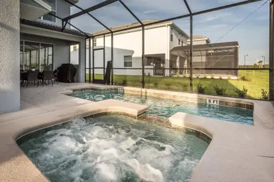 a swimming pool in front of a house at Last Minute Disney Private Pool Hot Tub Themed Bedrooms. Book Now 17198 in Kissimmee