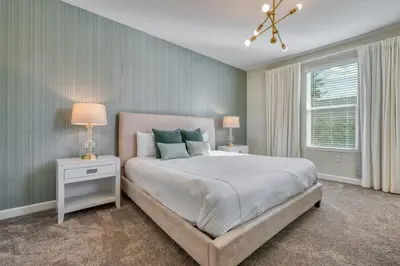 a bedroom with a bed and two lamps and a window at Last Minute Disney Private Pool Hot Tub Themed Bedrooms. Book Now 54267 in Kissimmee