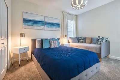 a bedroom with a bed and a couch in it at Last Minute Disney Private Pool Hot Tub Themed Bedrooms. Book Now 54267 in Kissimmee