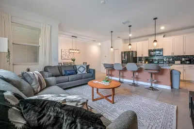 a living room with a couch and a table at Last Minute Disney Getaway Private Pool Themed Bedrooms. Book Now 91409 in Kissimmee