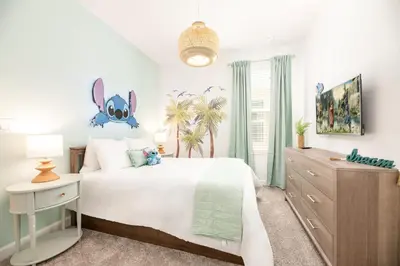 a bedroom with a large white bed and a palm tree at Last Minute Disney Getaway Villa with Private Pool Hot Tub. Book Now 81933 in Kissimmee