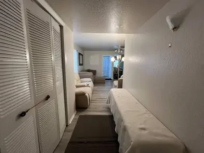 a living room with a couch and a bed in a room at Home in Kissimmee with Huge Backyard in Kissimmee