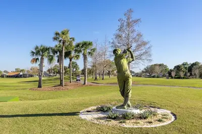 a statue of a golfer in a park at Disney and Airport 15 minutes from Luxury Condo in Orlando