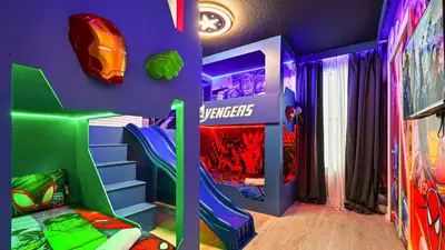 a childs room with a superhero themed bedroom at Luxurious 10-Bed Lakefront Retreat Near Disney in Kissimmee