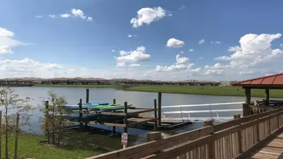 a dock with two boats on the water at Disney-Themed Oasis with Private Pool & Spa in Kissimmee