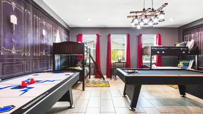 a room with two pool tables and a bunk bed at Disney-Themed Oasis with Private Pool & Spa in Kissimmee