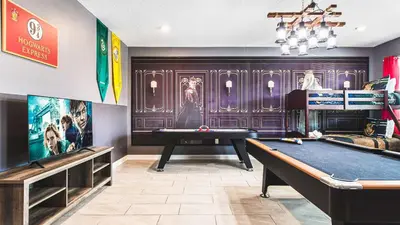 a room with a pool table and a tv at Disney-Themed Oasis with Private Pool & Spa in Kissimmee