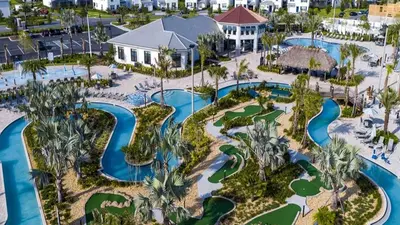 an aerial view of a resort with pools and golf courses at Storey Lake 2BR Cozy Resort Home Close to Disney in Kissimmee