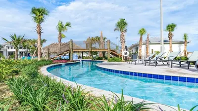 a pool at a resort with palm trees at Storey Lake Cozy Resort Home Pool Spa Disney Theme in Kissimmee