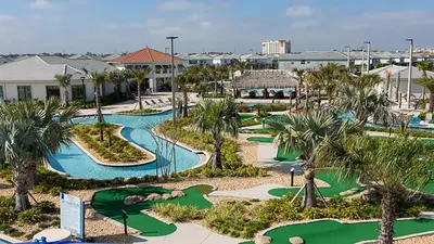 an aerial view of a golf course at a resort at 4BR Tropical Storey Lake Townhome Private Pool in Kissimmee