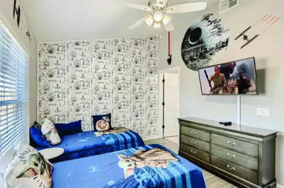 a bedroom with two beds and a ceiling fan at T2501M Windsor Hills Resort 3Bedrm Private Pool in Orlando