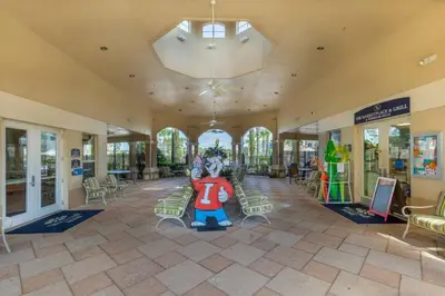 a building with a lobby with a large mickey mouse statue in the middle at T2501M Windsor Hills Resort 3Bedrm Private Pool in Orlando