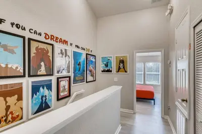 a hallway with paintings on the wall at T7676F Windsor Hills Resort 3Bed POOL Pet Friendly in Orlando