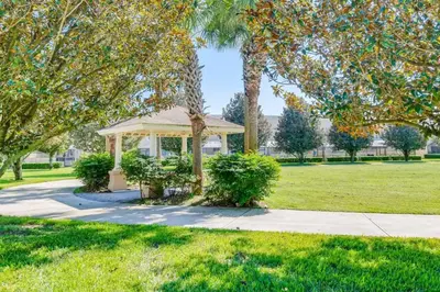 a gazebo in a park with trees at T7676F Windsor Hills Resort 3Bed POOL Pet Friendly in Orlando