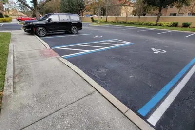 a black suv parked on the side of a street at C7671-402 Windsor Hills Resort 2Bedrm Themed Condo in Orlando