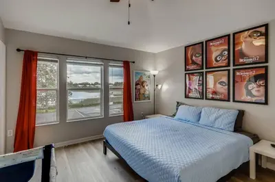 a bedroom with a bed and two windows at T7673F Windsor Hills Resort 3Bed POOL Pet Friendly in Orlando
