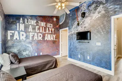 a room with a bed in a galaxy far far away at T7674O Windsor Hills Resort 3Bedrm 2miles Disney in Orlando
