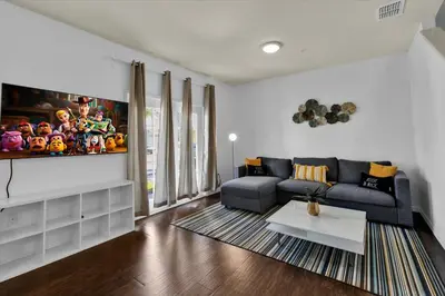 a living room with a couch and a table at 3206 Gold in Kissimmee