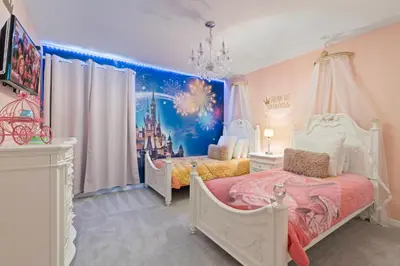 a bedroom with two beds and a disney mural at Amazing 5Bedrooms4.5Baths- Nexto to Disney in Kissimmee