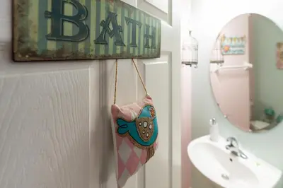 a towel hanging on the door of a bathroom at Amazing 5Bedrooms4.5Baths- Nexto to Disney in Kissimmee