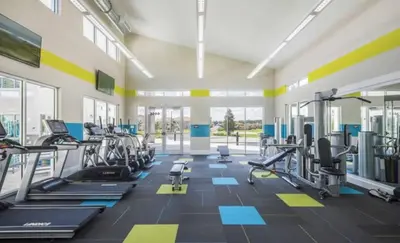 a gym with several treadmills and cardio machines at Amazing 5Bedrooms4.5Baths- Nexto to Disney in Kissimmee