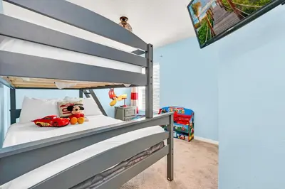 a childs bedroom with a bunk bed with a toy at 8462 Secret Key Cove in Kissimmee