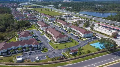 an aerial view of a resort with a parking lot at Fabulous townhome near the Parks in Kissimmee
