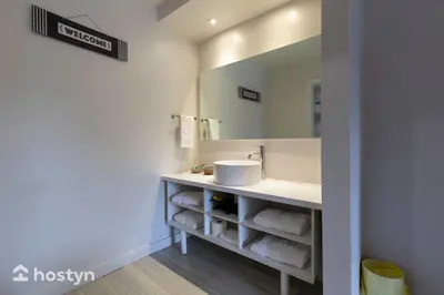 a bathroom with a sink and a mirror at Amazing hotel room near Disney for 4 people in Kissimmee