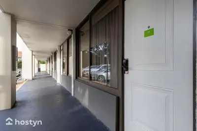 a hallway of a building with a car in the window at Amazing hotel room near Disney for 4 people in Kissimmee