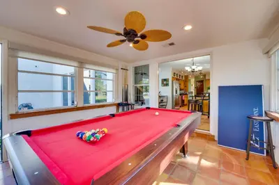 a pool table in a living room with a ceiling at 1-Acre Backyard and Gym Spacious Apopka Escape! in Orlando