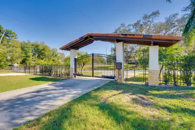 a gate at a park with a metal fence at 1-Acre Backyard and Gym Spacious Apopka Escape! in Orlando