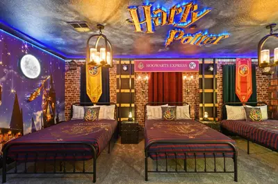 two beds in a room with a harry potter sign at 5 Star Exceptional Luxury Villa at Storey Lake mins to Disney in Kissimmee