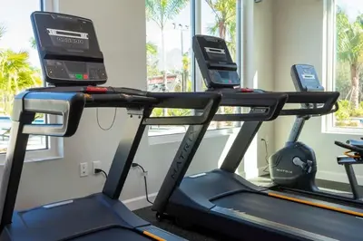 a gym with two treadmills and a treadmill at 9 min to Disney w Pool- 4BD 3BA - FREE Waterpark in Kissimmee