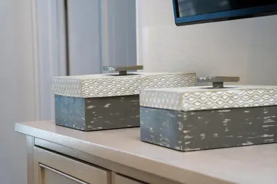 three boxes sitting on top of a table at Private Pool! Big and Stylish House! in Orlando