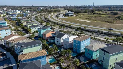 an aerial view of a city with houses and a highway at Private Pool! Big and Stylish House! in Orlando