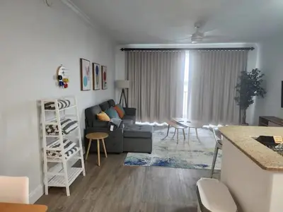 a living room with a couch and a table at Orlando 3rd Floor - Blue Heron in Orlando