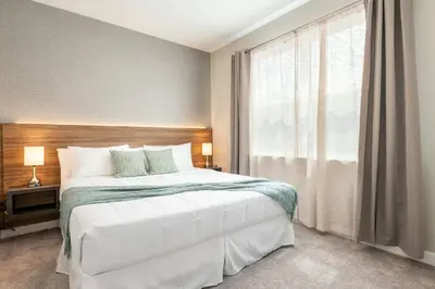 a bedroom with a large bed and a window at 8005 Stunning Villa Disney Park Proximity in Orlando