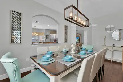 a dining room with a table and chairs at 7752 Tosteth in Kissimmee