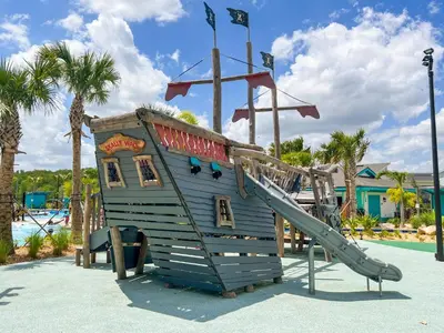 a playground with a slide and a play structure at Happily Ever Home, Your Family Dream Beyond Disney in Kissimmee