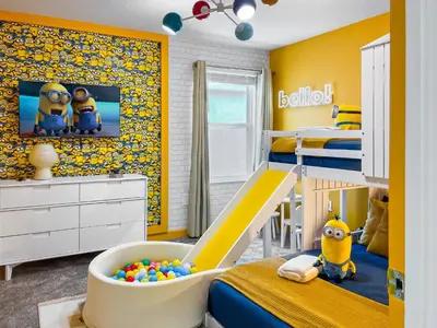 a childs bedroom with yellow walls and a bunk bed at Happily Ever Home, Your Family Dream Beyond Disney in Kissimmee