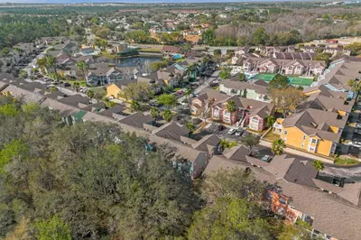 an aerial view of a residential neighborhood with houses at Ground Level Condo with Garden Patio in Kissimmee