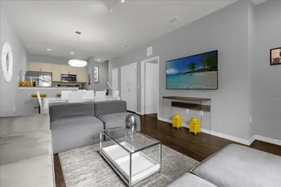 a living room with a couch and a table at 3 Bedrooms 2 Bathrooms Lucaya Village 13-107 in Kissimmee