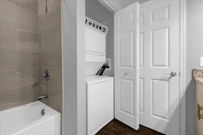 a bathroom with a toilet and a white door at 3 Bedrooms 2 Bathrooms Lucaya Village 13-107 in Kissimmee