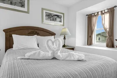 a swan made out of towels on a bed at Bluelakeview Luxury Villa with Private Pool & Spa plus Lake Views, BBQ, Games Room in Orlando