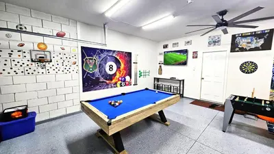 a billiard room with a pool table in it at Bluelakeview Luxury Villa with Private Pool & Spa plus Lake Views, BBQ, Games Room in Orlando