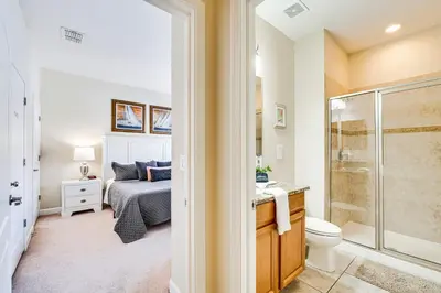 a bathroom with a bed and a shower and a toilet at Resort Perks and Private Pool Kissimmee Retreat! in Kissimmee