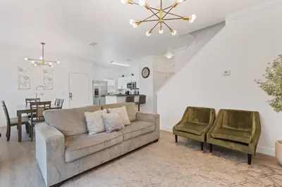 a living room with a couch and two chairs at Cozy 4Bedrooms At Lucaya- 7 miles from Disney in Kissimmee