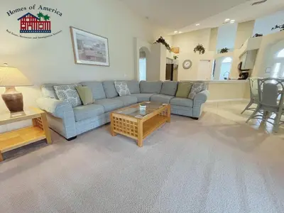 a living room with a couch and a coffee table at 35 - Relax & Play 4-Bed Villa with Pool & Game Room Minutes to Disney in Orlando